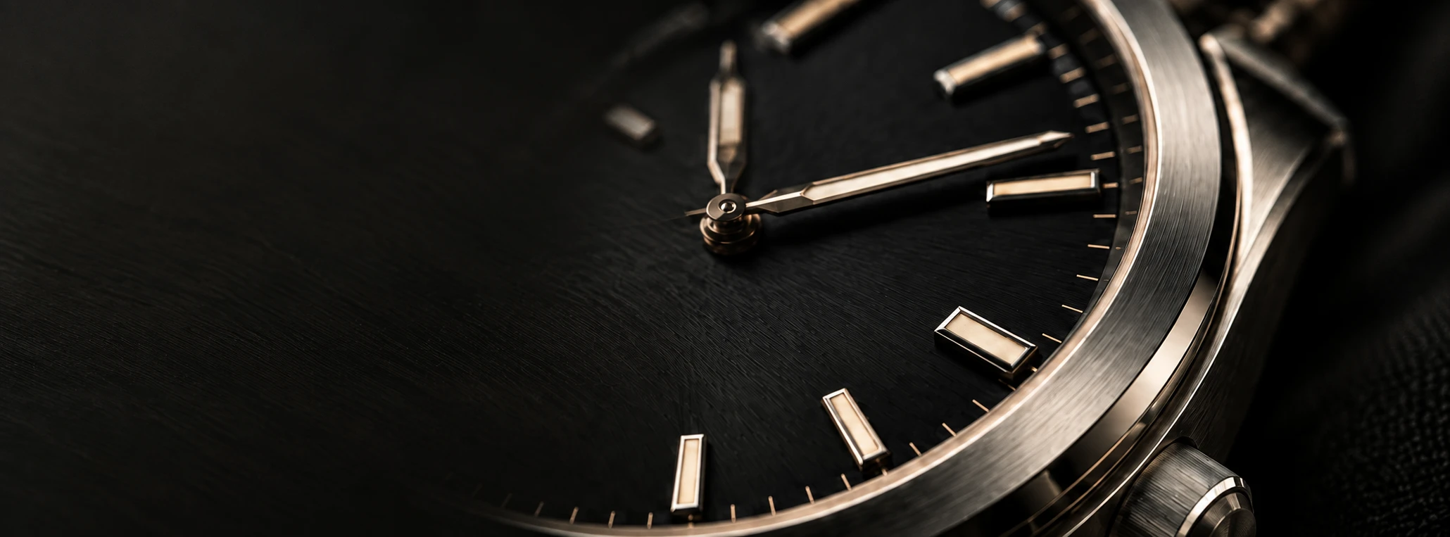 Macro detail of a black-dial mechanical watch